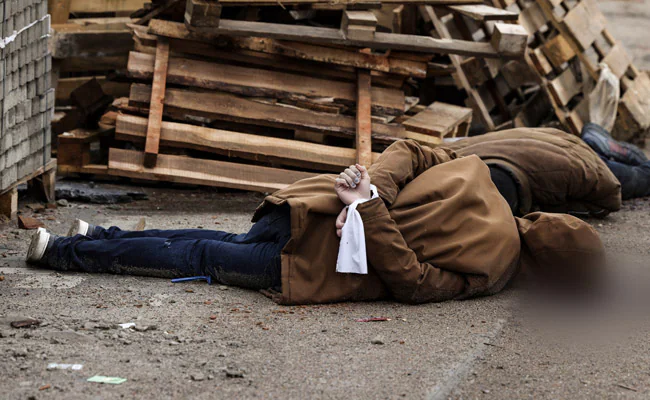 In Ukraine Road, Body With Hands Tied, A Bullet Wound To The Head