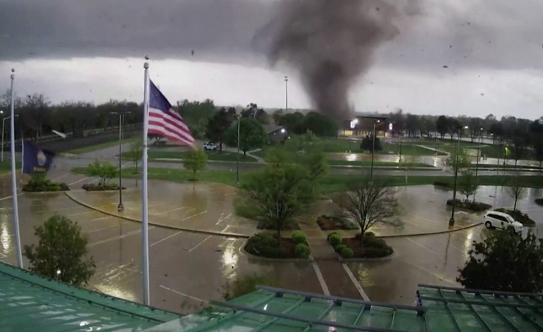CCTV captures Kansas twister spinning in car park